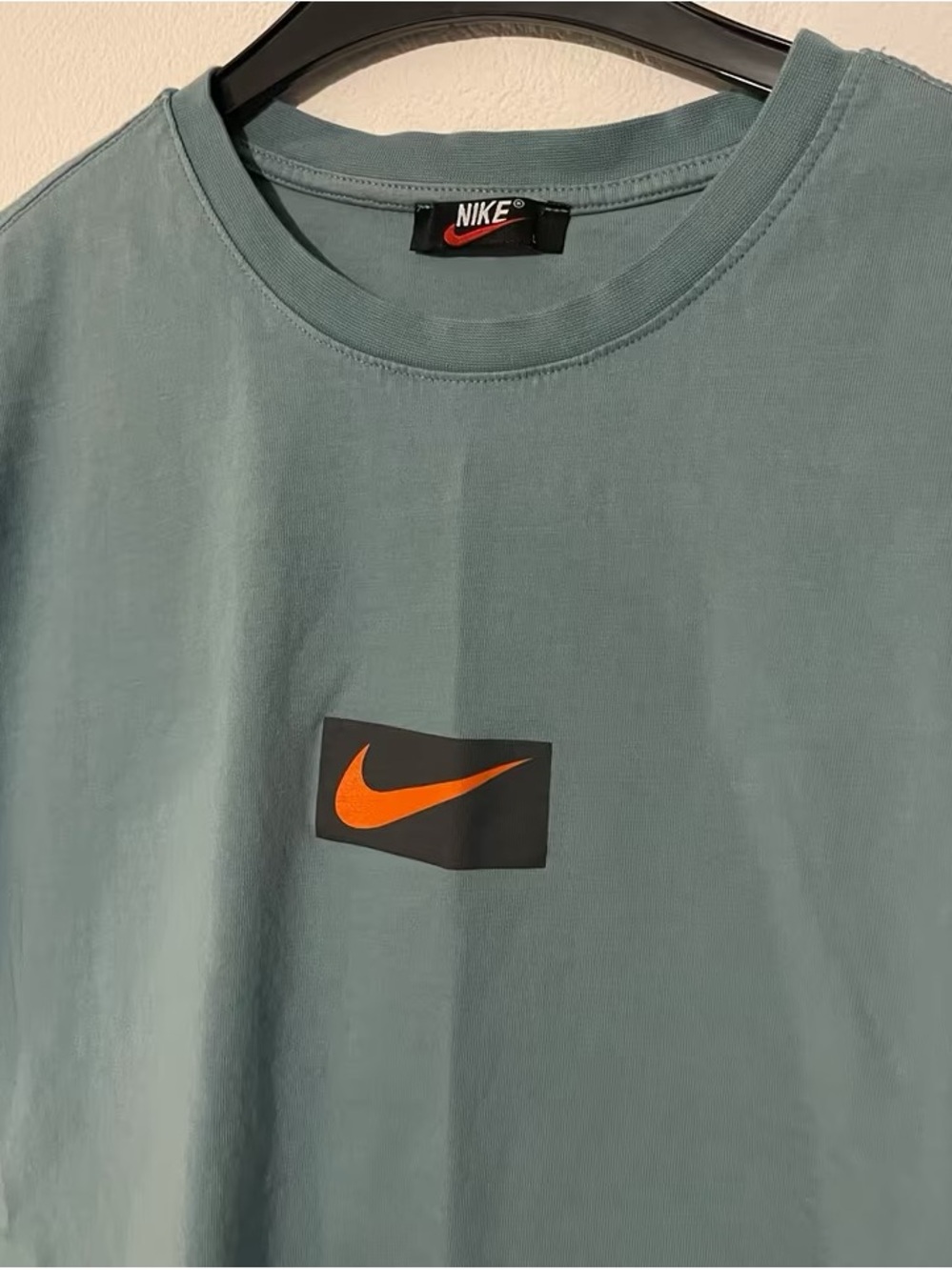 Nike Men's Teal Crew T‑Shirt with Orange Swoosh